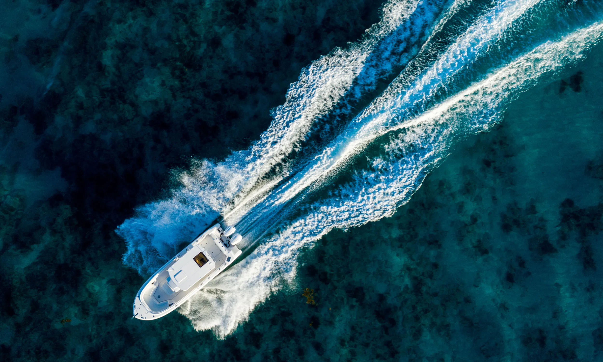 EdgeWater 285CC anchored in a picturesque cove in the Arabian Gulf.
